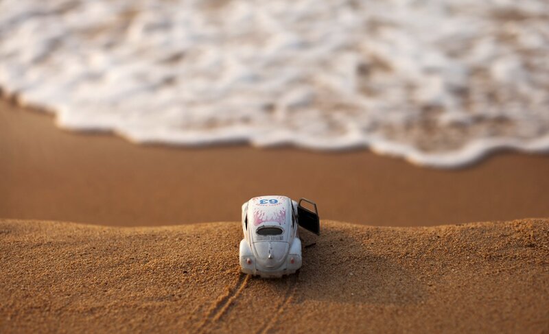 Toy Car on Beach — Brown, Serene