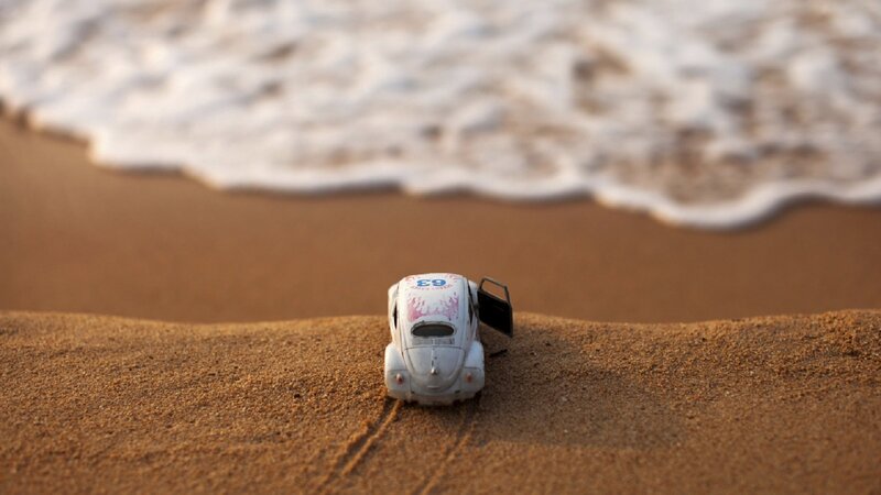 Toy Car on Beach — Brown