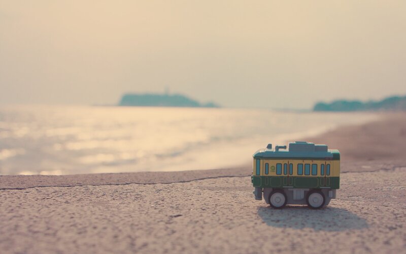 Toy train on a beach