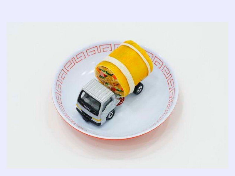 Toy truck carrying a rolled omelet