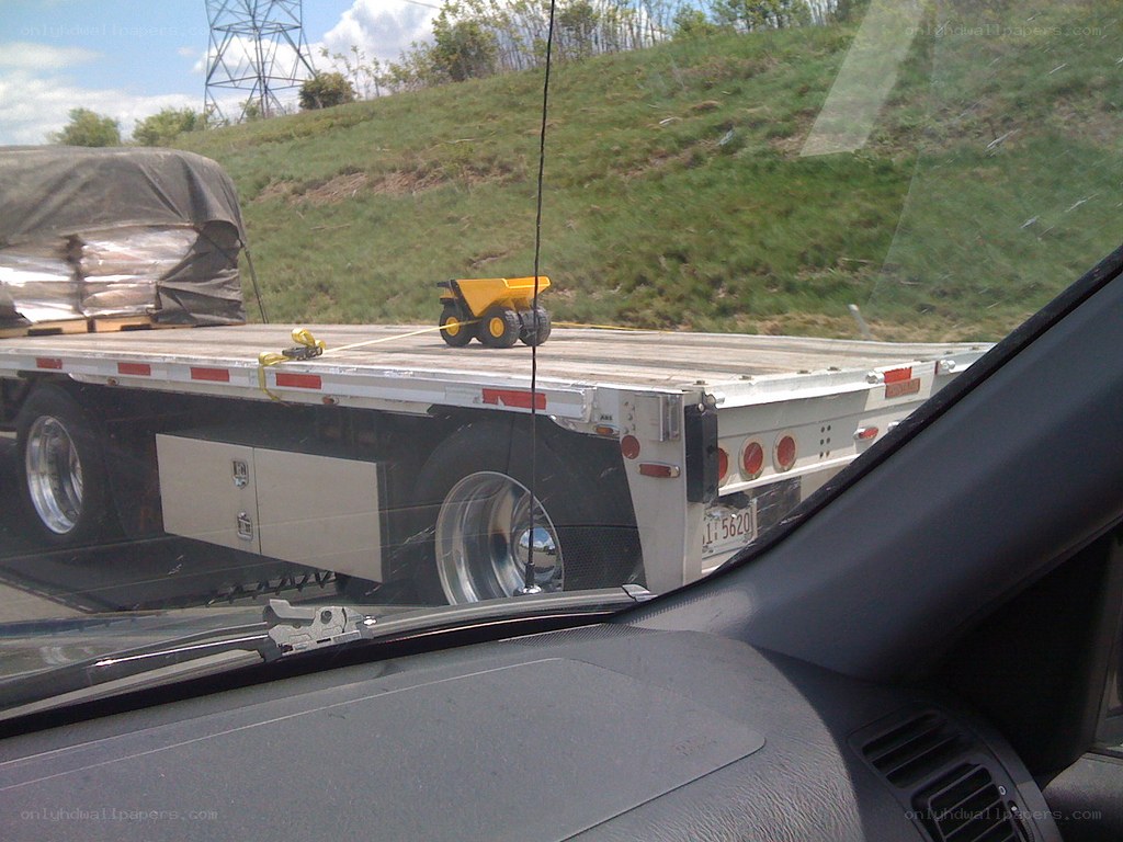 Toy truck on flatbed trailer