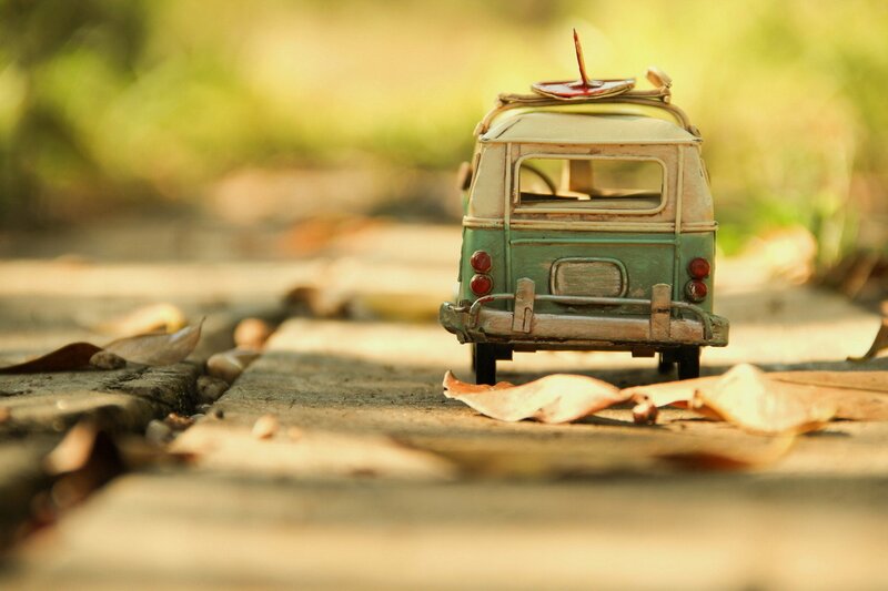 Toy van with surfboard on roof