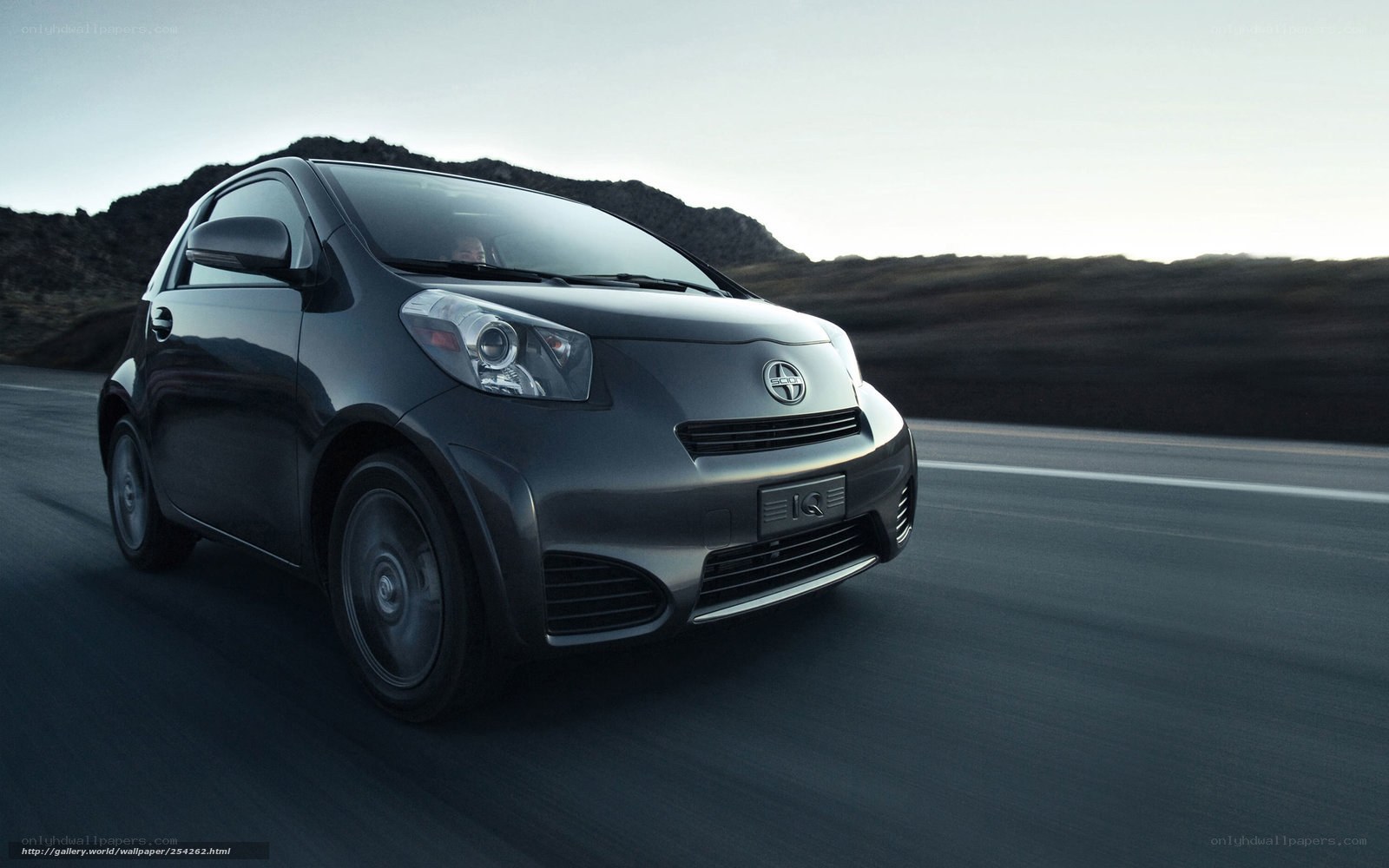 Toyota iQ driving on road