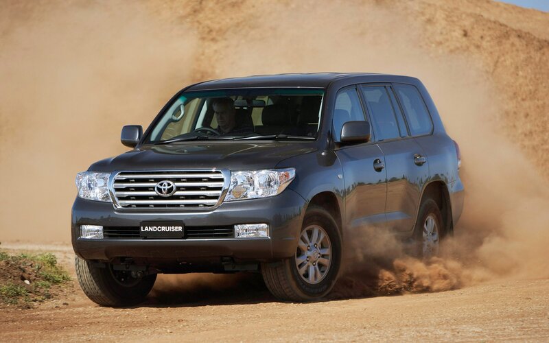 Toyota Land Cruiser driving on dirt