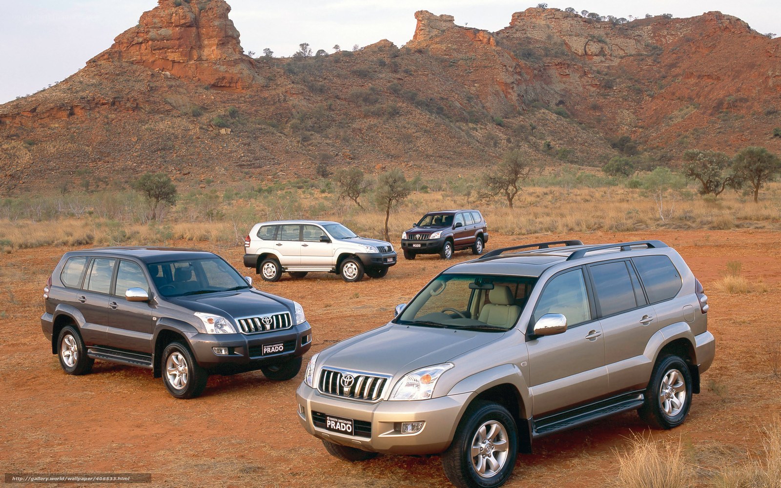 Toyota Prado SUVs in desert