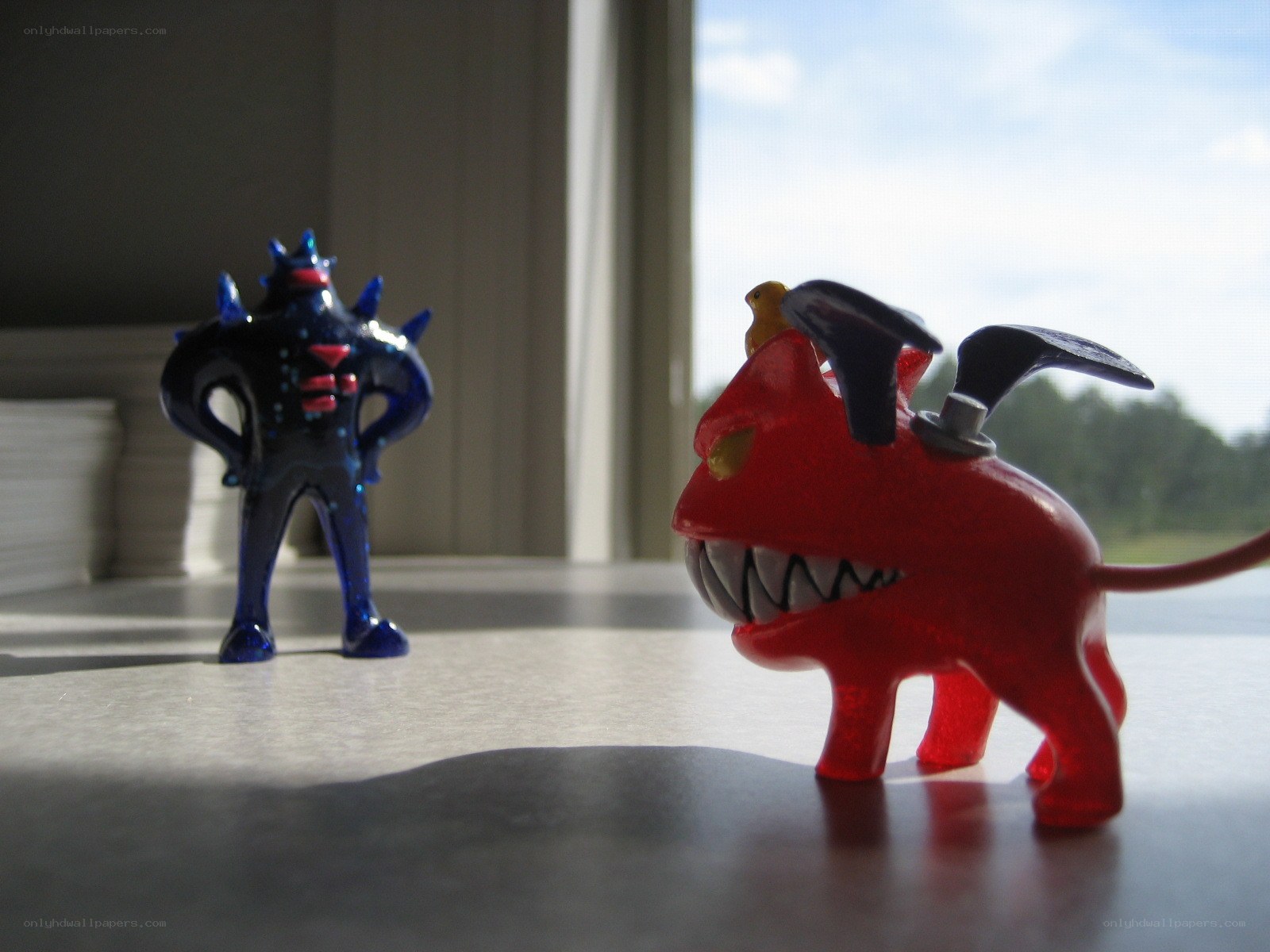 Toys on a table by window