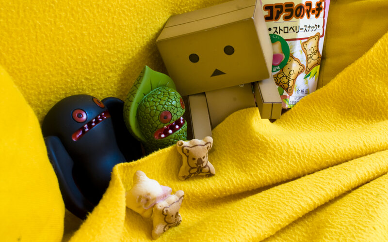 Toys on a yellow blanket