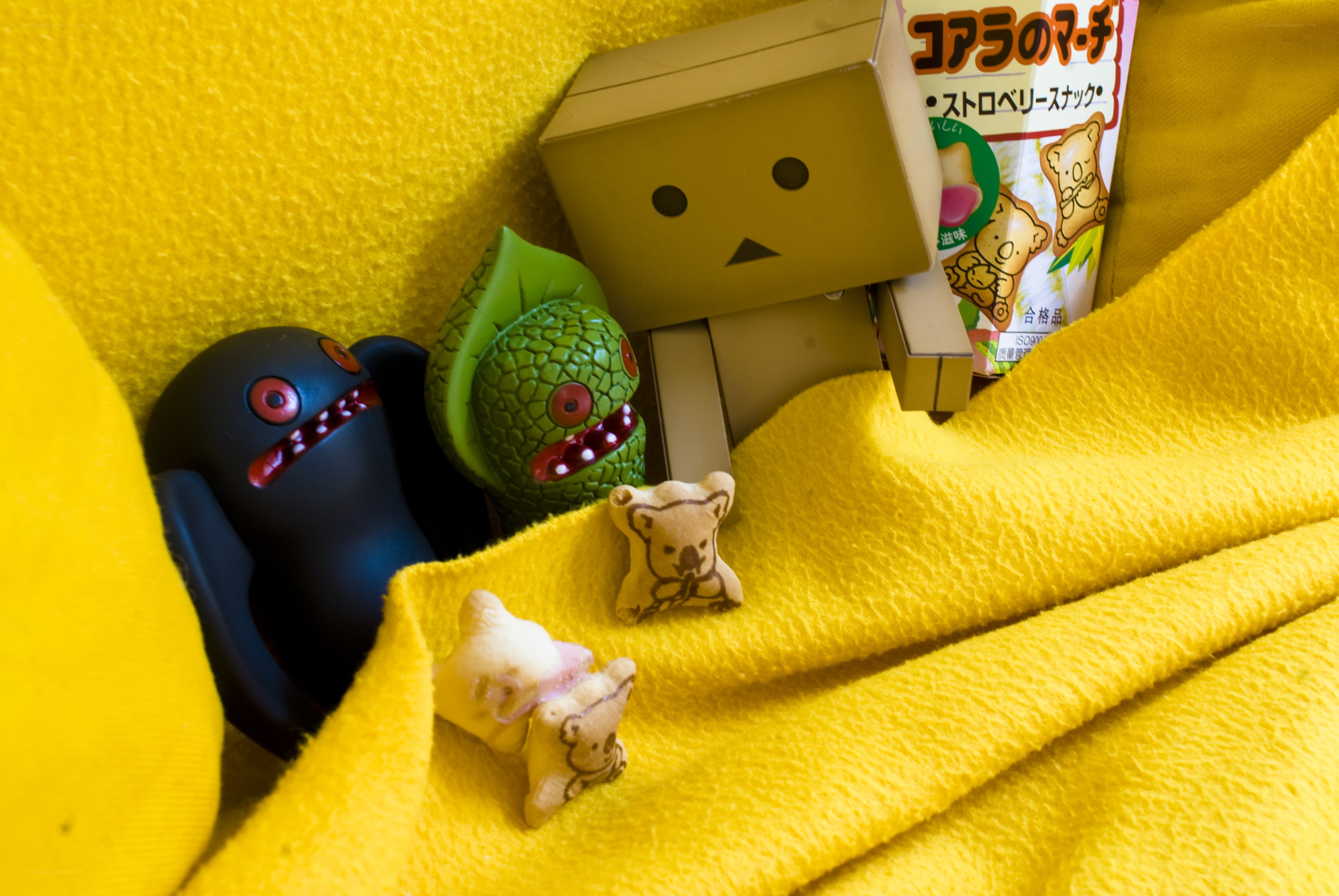 Toys on a yellow blanket