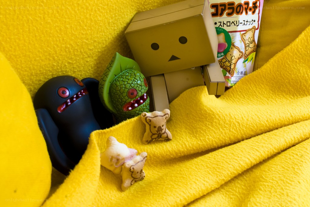Toys under a yellow blanket