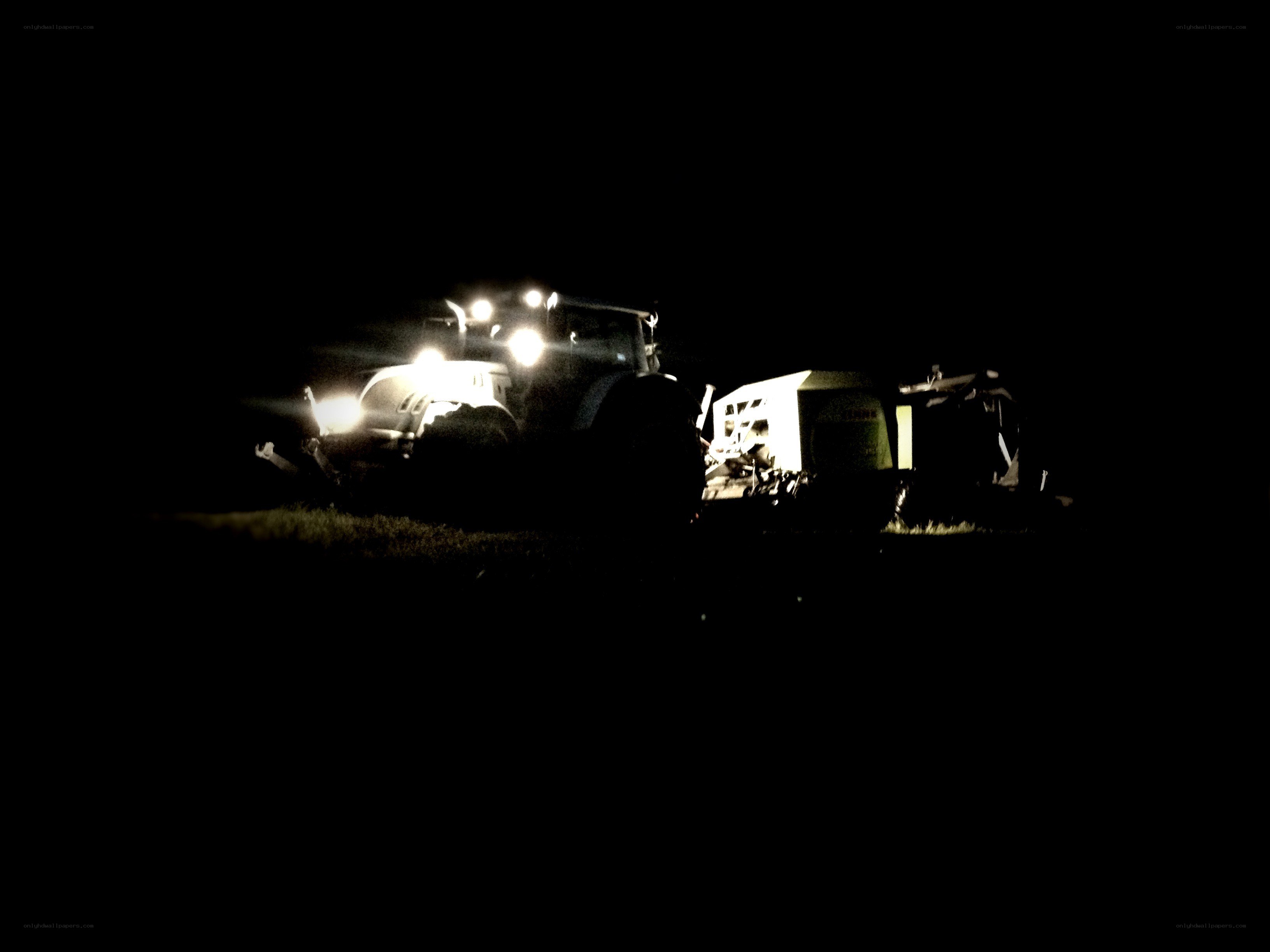 Tractor at night with lights on