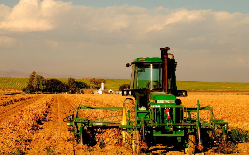 Tractor in a harvested field