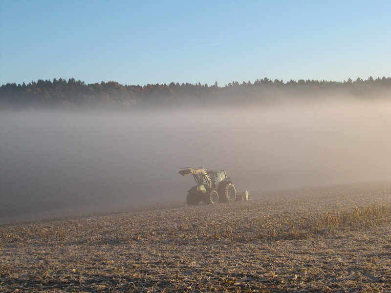 Tractor in Foggy Field
