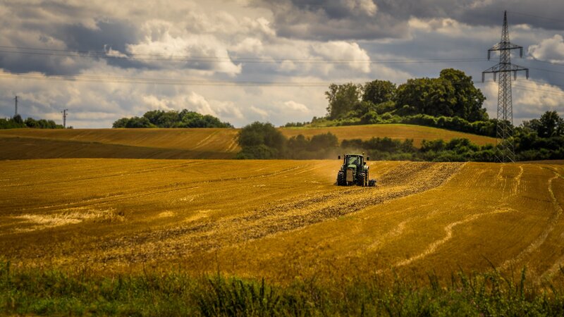 Tractor in Harvested Field