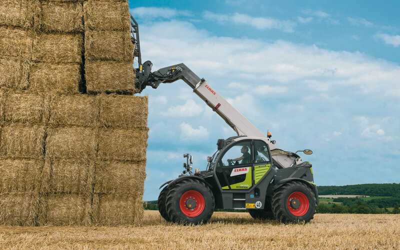 Tractor Moving Hay Bales