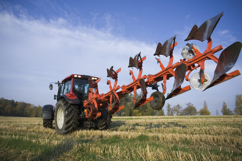 Tractor plowing a field