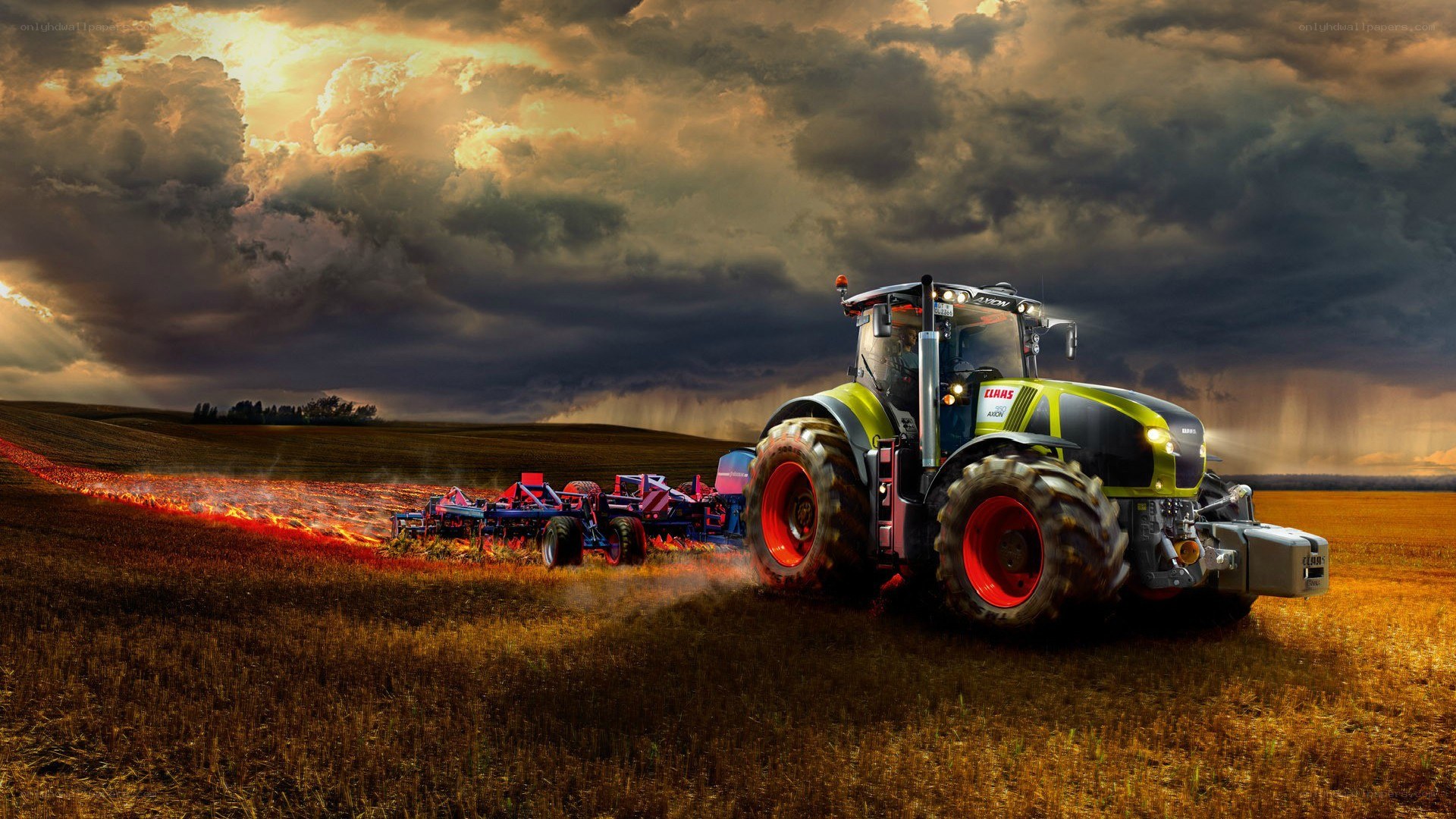 Tractor plowing field at sunset