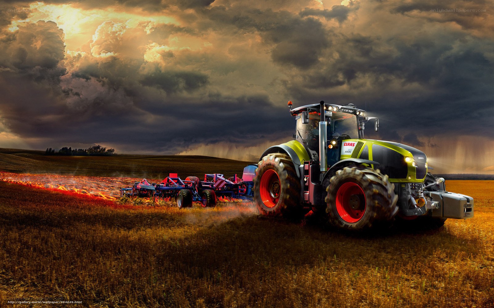 Tractor plowing field at sunset