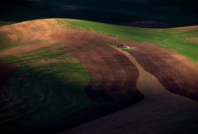 Tractor Plowing Field — Green, Dramatic