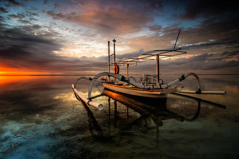 Traditional Boat at Sunset — Orange, Dramatic