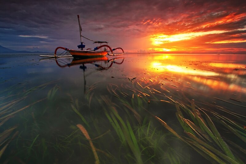 Traditional Boat at Sunset — Orange