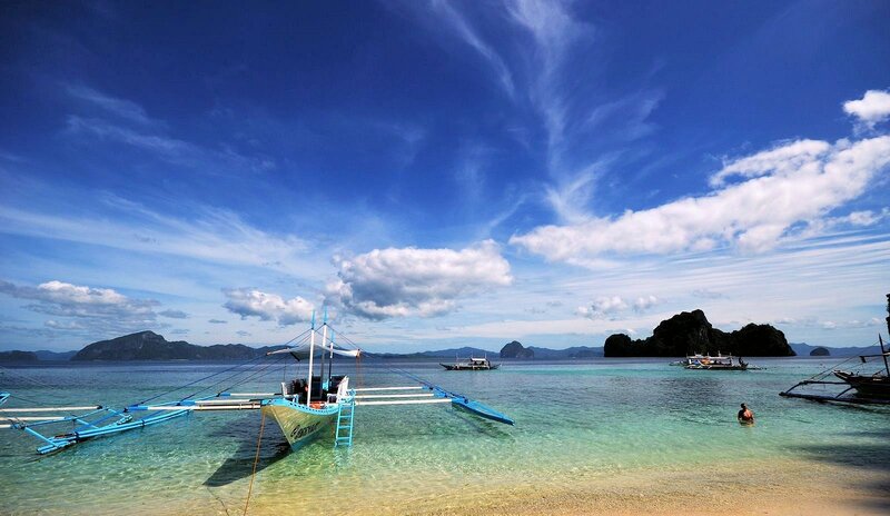 Traditional Boat in Clear Water — Blue
