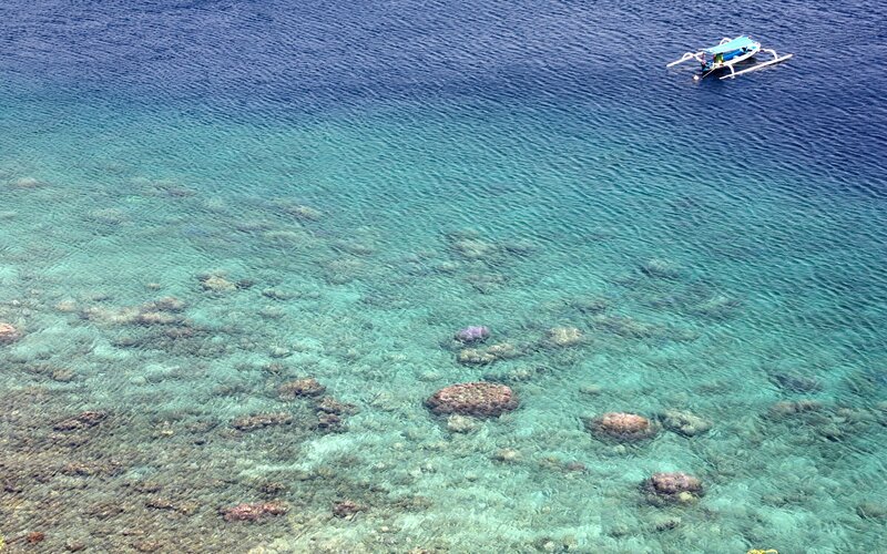 Traditional Boat in Clear Water