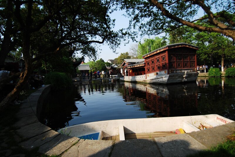 Traditional boat on a garden pond