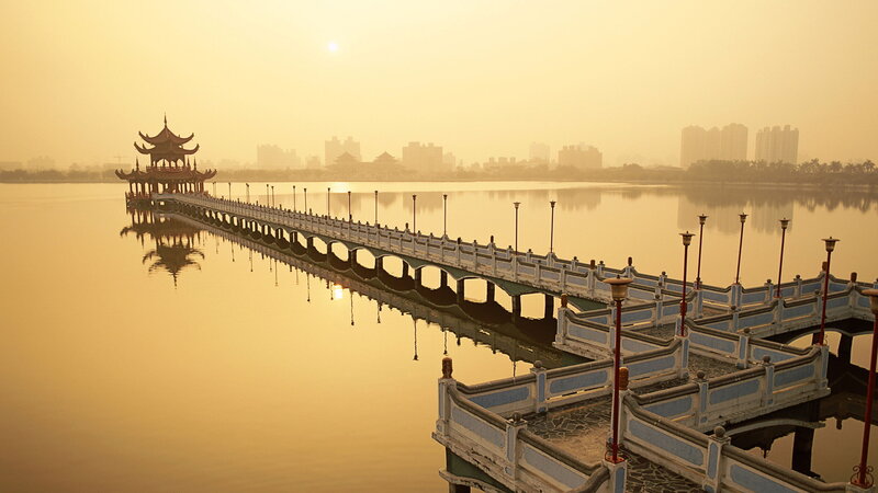 Traditional bridge over a lake at sunrise
