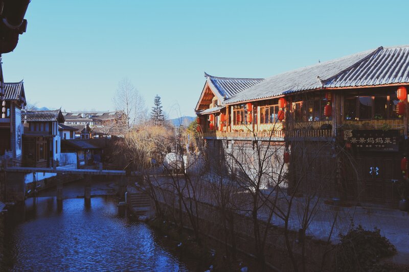 Traditional Buildings by River — Blue