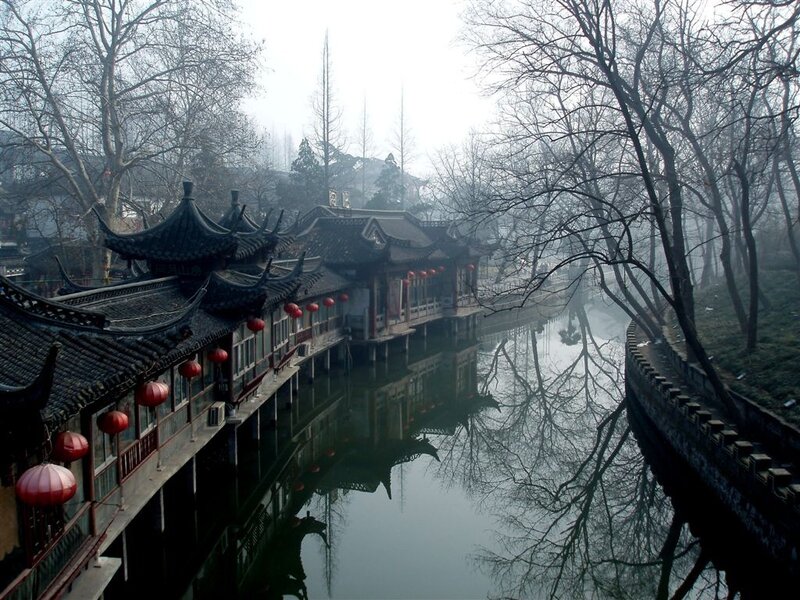 traditional chinese buildings by a canal