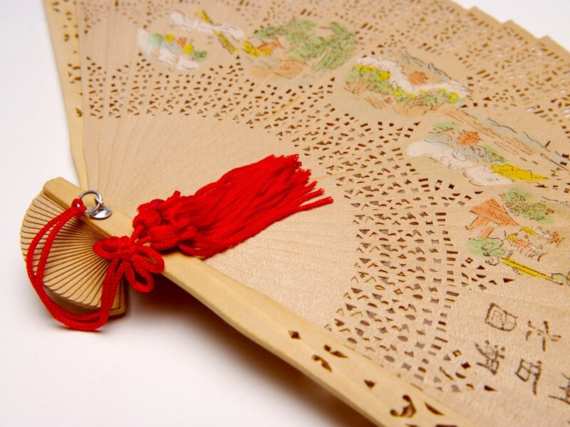 Traditional Chinese fan with red tassel