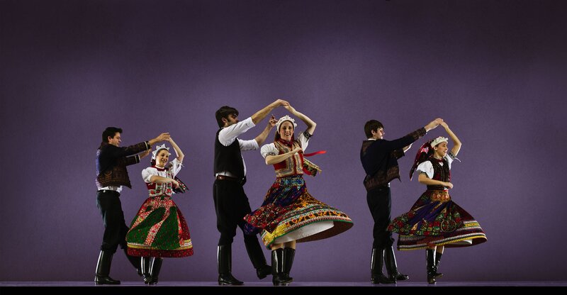 Traditional dancers in colorful costumes