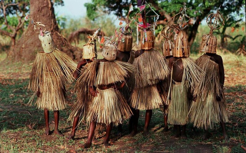 Traditional dancers in straw costumes