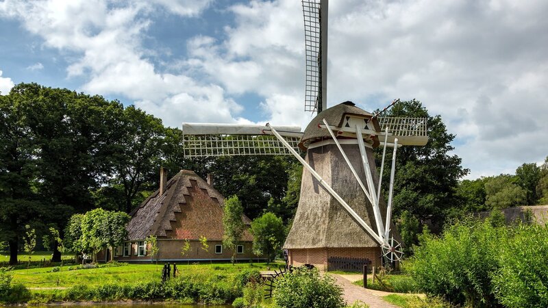Traditional Dutch windmill and house