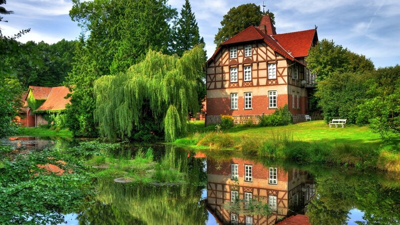 Traditional house by a pond