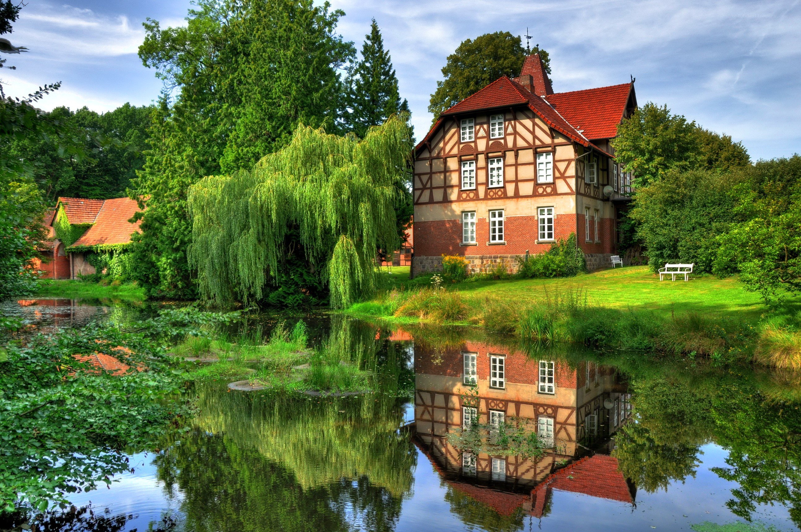 Traditional house by a pond