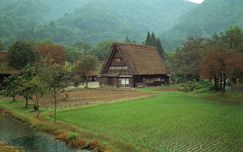 Traditional Japanese farmhouse in rural landscape