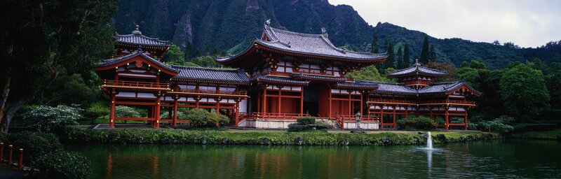 Traditional Japanese temple by a pond