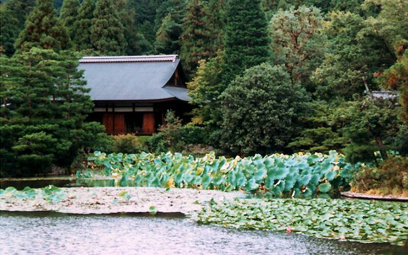 Traditional Japanese temple by a pond
