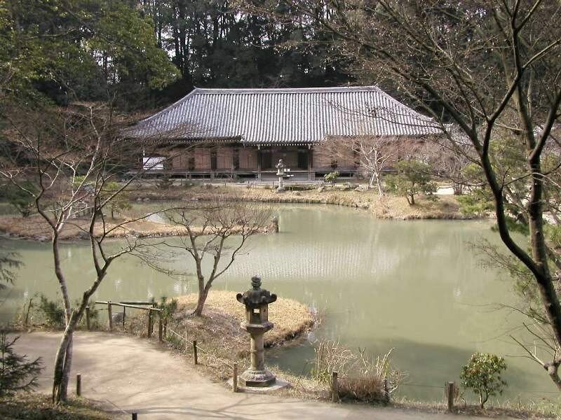 traditional japanese temple by pond