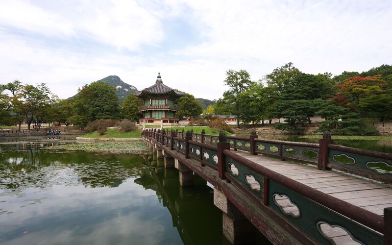 Traditional Korean pavilion by a pond