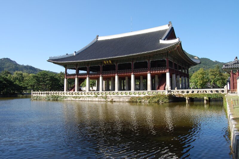 Traditional Korean pavilion by a pond