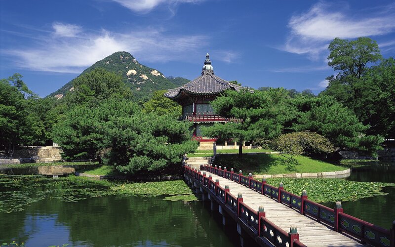 Traditional Korean pavilion by a pond