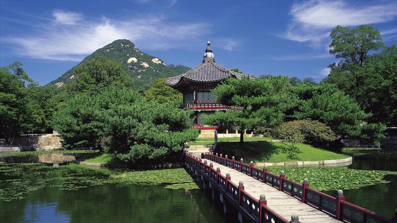 Traditional Korean pavilion by a pond