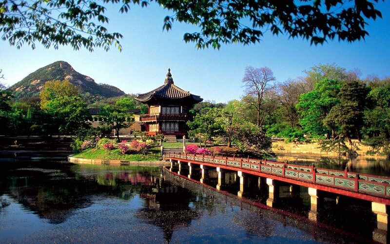 Traditional Korean pavilion by a pond