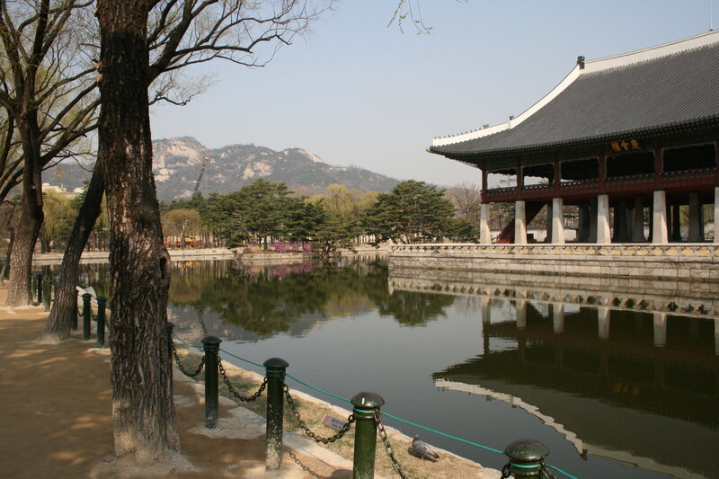 Traditional Korean pavilion by a pond