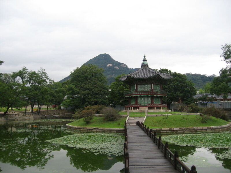 Traditional Korean pavilion by pond