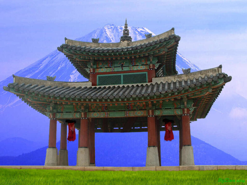 Traditional Korean pavilion with mountain
