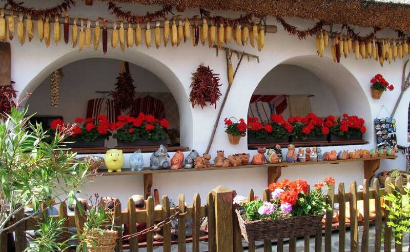 Traditional market stall with corn and pottery
