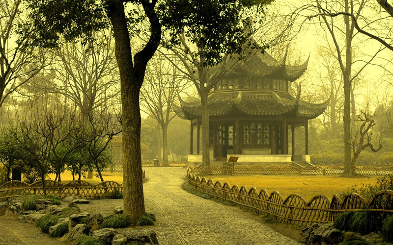 Traditional pavilion in a misty garden
